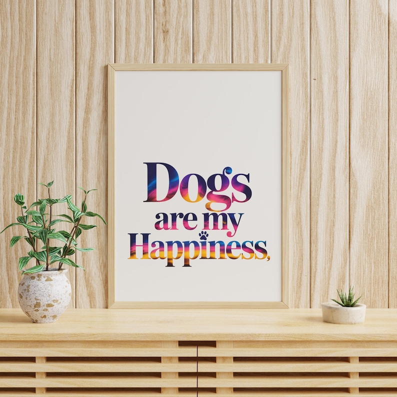 May include: Framed art print with the text "Dogs are my Happiness" in colorful, gradient lettering. The artwork is displayed on a wooden cabinet with a small potted plant and a succulent.