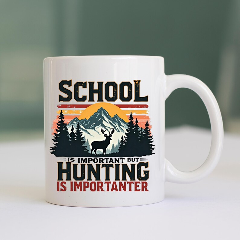 May include: White ceramic mug with a black and orange mountain and forest design. The mug features the text "SCHOOL IS IMPORTANT BUT HUNTING IS IMPORTANTER" in black and orange lettering. A deer silhouette is also included.