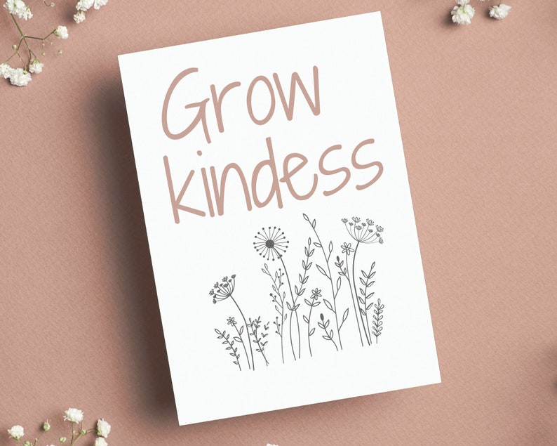May include: White card with the text "Grow kindness" in black script font. The card is decorated with a black line drawing of a field of wildflowers.