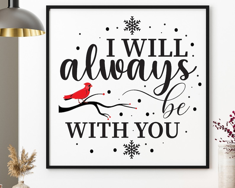 May include: A black framed print with a white background and black text that reads "I will always be with you." A red cardinal bird is perched on a branch with red berries. The print also features a snowflake and black dots.