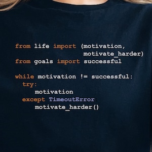 May include: A black t-shirt with a code snippet printed on it. The code reads: "from life import (motivation, motivate harder) from goals import successful while motivation != successful: try: motivation except TimeoutError motivate_harder()"