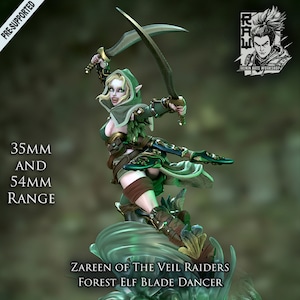 May include: A green and brown miniature figurine of a female elf warrior holding two swords. The figurine is posed in a dynamic action pose. The text "Zareen of the Veil Raiders Forest Elf Blade Dancer" is printed below the figurine.