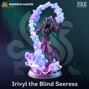 May include: A 3D printed miniature of a female figure with long, dark hair and a flowing robe. She is holding a swirling cloud of blue and pink energy in her hands. The miniature is set on a circular base and is labeled "Irivytl the Blind Seeress".