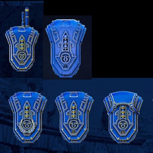 May include: A selection of blue and gold decorative shields with detailed patterns. Some shields feature chains, antennas, or small pouches. The shields have a metallic finish and are displayed against a dark backdrop.