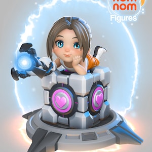May include: A 3D printed figurine of a female character from the video game Portal 2. The character is wearing an orange jumpsuit and is sitting on a cube with two pink hearts. The cube is on a platform with a blue and white energy field around it. The figurine is part of the Nom Nom Figures collection.