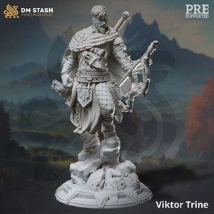 May include: A white 3D printed miniature of a warrior figure holding a bow and arrow. The figure is wearing armour and a cloak. The miniature is standing on a rocky base. The text "Viktor Trine" is printed below the base.