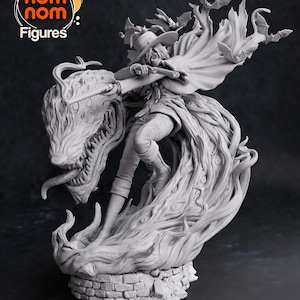 May include: A gray, detailed, 3D printed figurine of a character with a hat and cape riding a monstrous creature with a long tongue. The creature is surrounded by bats. The figurine is on a brick base.