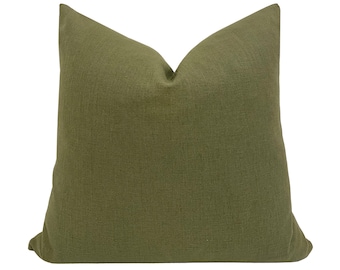 May include: A solid green square pillow with a soft, textured fabric.