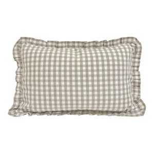 May include: A beige and white gingham pillow with a ruffled edge.