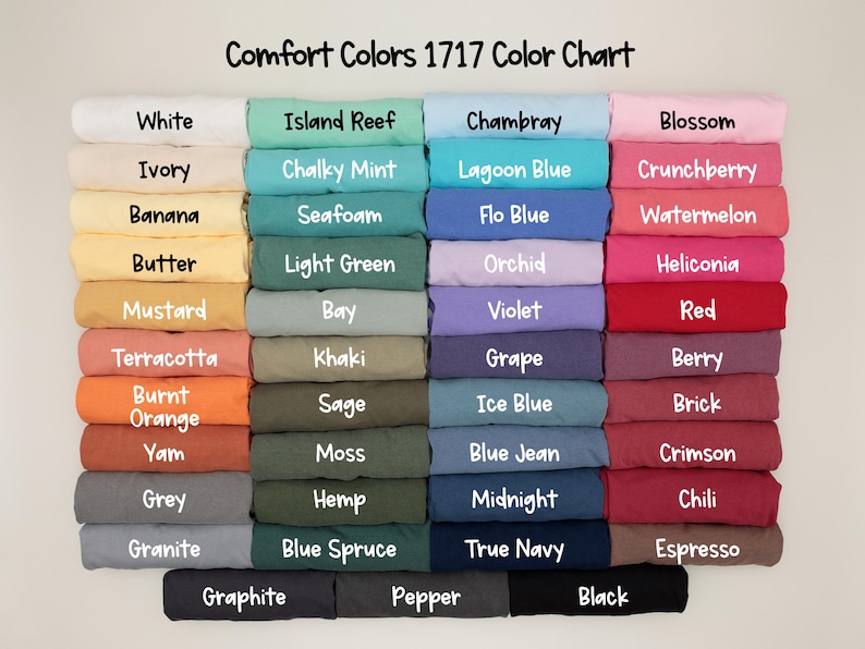 May include: A color chart titled "Comfort Colors 1717 Color Chart" displays a variety of fabric colors. The colors include white, ivory, banana, butter, mustard, terracotta, burnt orange, yam, grey, granite, graphite, island reef, chalky mint, seafoam, light green, bay, khaki, sage, moss, hemp, blue spruce, pepper, chambray, lagoon blue, flo blue, orchid, violet, grape, ice blue, blue jean, midnight, true navy, blossom, crunchberry, watermelon, heliconia, red, berry, brick, crimson, chili, espresso, and black.