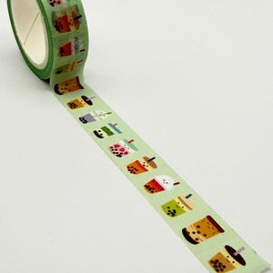 May include: A roll of green washi tape with a repeating pattern of bubble tea cups. The tape is unrolled, revealing the adhesive side with illustrated drinks. Suitable for scrapbooking, journaling, and crafts. The tape is approximately 1.5 cm wide.