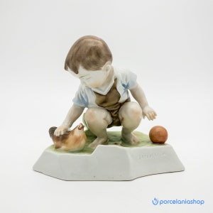 Boy with a Hen, very rare Zsolnay porcelain figurine