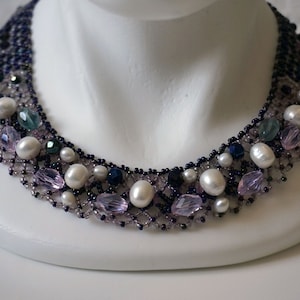 The braided Ukrainian traditional necklace with natural pearls and fluorites and glass beads.