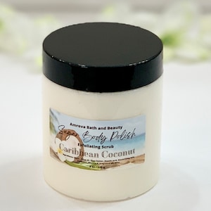 May include: A white jar with a black lid containing a sugar body polish. The label reads "Amreva Bath and Beauty Sugar Body Polish Exfoliating Scrub Caribbean Coconut".