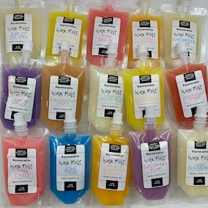 May include: Assortment of squeezable wax melts in various colors, including yellow, pink, purple, and orange. Each pouch is labeled with a scent name like "Pink Sugar" or "Lavender Vanilla". The pouches are 4 oz (113 g) each.