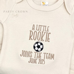 Embroidered A little Soccer Rookie Joins the Team Bodysuit • Custom Soccer Pregnancy Announcement • Soccer Baby Due Date • Soccer Fan