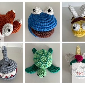 May include: A collection of crocheted animal toys, including a fox, a cookie monster, a bee, a turtle, a shark, and a unicorn. The toys are all handmade and have bright colors and friendly faces.