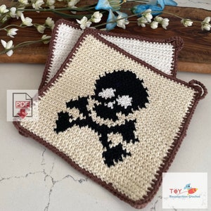 May include: Two crocheted pot holders with a brown border. One pot holder features a black and white skull and crossbones design. The pot holders are made by Toy Recollection Crochet.
