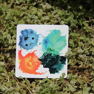 May include: A sticker with four watercolor illustrations of different elements: blue water, green air, orange fire, and black earth.
