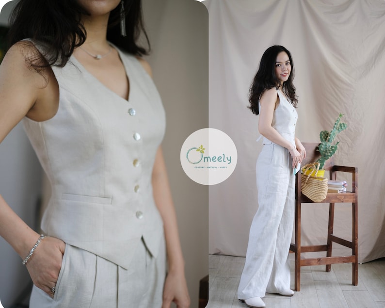 May include: A light beige linen vest with a v-neck and button closure. The vest has a pocket on the left side. The vest is paired with matching wide-leg linen pants.