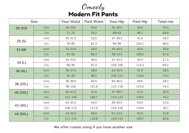 Op de afbeelding: Een maattabel voor Omeely Modern Fit broeken met kolommen voor maat, taille, heup en totale stijging in inches en centimeters. De tabel bevat maten van 28 (XS) tot 44 (5XL) met specifieke numerieke gegevens.