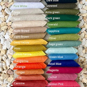 May include: A color chart labeled Omeely Natural 100% Linen 200gsm displaying fabric swatches in various shades including black, brown, grey, white, ivory, sand, cream, yellow, orange, red, green, blue, pink, and purple with printed color names.