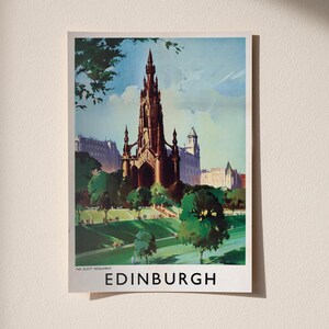 May include: A vintage-style travel poster featuring the Scott Monument in Edinburgh, Scotland. The illustration depicts the dark gothic spire rising above green parkland and trees under a blue sky, with the text THE SCOTT MONUMENT EDINBURGH below.