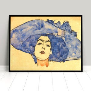 May include: A watercolour painting of a woman wearing a large blue hat. The woman's face is visible, and she has dark hair and a fair complexion. The background is a pale yellow.