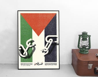 May include: A rectangular poster featuring a stylized flag design with a red triangle, green and black vertical stripes, and a white central area. Broken white chains are depicted over the stripes. Text in Arabic and English is at the bottom.