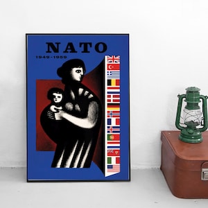 May include: A framed poster titled NATO 1949-1959 featuring a stylized black and white illustration of a person holding a child against a blue and red background. A vertical column of national flags is displayed on the right side of the poster.