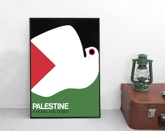 May include: A rectangular framed poster featuring a stylized white dove graphic against a background of black, red, and green. The text PALESTINE A HOMELAND DENIED is printed in white at the bottom left corner of the artwork within the black frame.