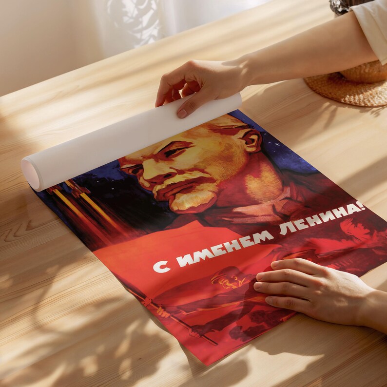 May include: A vintage Soviet propaganda poster featuring a portrait of Lenin with the text "С именем Ленина!" (With the name of Lenin!). The poster is red, white, and blue with a star in the background.