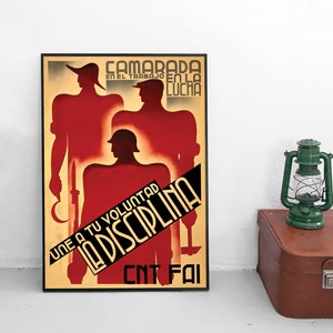 May include: A vintage propaganda poster with a red, white, and black color scheme. The poster features three silhouetted figures of men in military uniforms. The text on the poster reads "Camarada en el trabajo en la lucha Une a tu voluntad la disciplina CNT FAI".