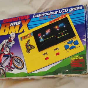 Grandstand, &quot;BMX Flyer&quot;, boxed, Lcd, Lsi, VFD, handheld vintage game console, 80s retro collectors item, backlit screen, game and watch