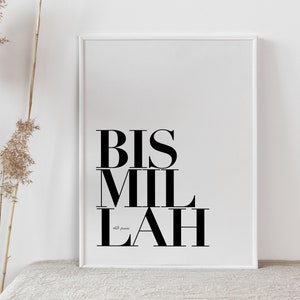 May include: A white framed print with the Arabic phrase "Bismillah" in black text. The phrase is written in a bold, modern font.