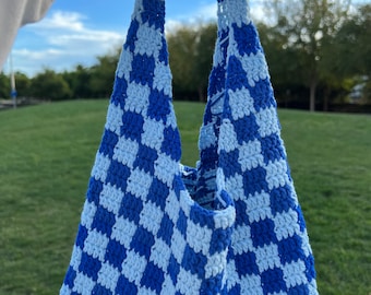 May include: A blue and white checkered crochet tote bag.