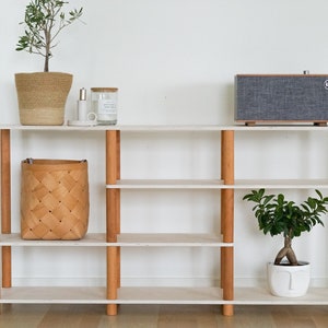 Unique low Montessori bookshelf. Custom corner bookshelf and tall narrow bookshelf.