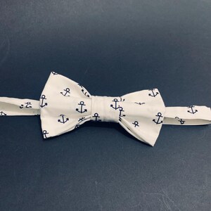 White bow tie with navy ink