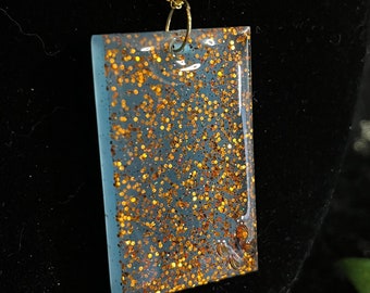 Blue Firestone effect resin rectangular pendant with 3D butterfly