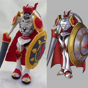 May include: A crocheted amigurumi figure of a red and white knight with a sword and shield. The figure is based on the character from the Digimon anime series.