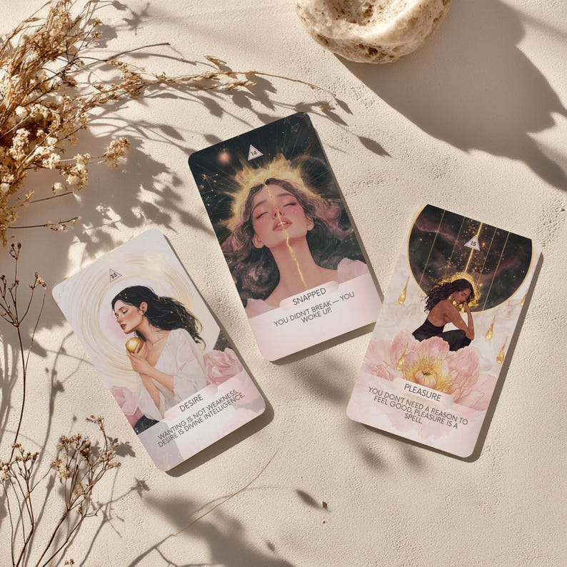 May include: Three oracle cards with illustrations and text. The cards feature images of women with celestial elements. The text on the cards includes the words "Desire", "Snapped", and "Pleasure", along with related phrases.
