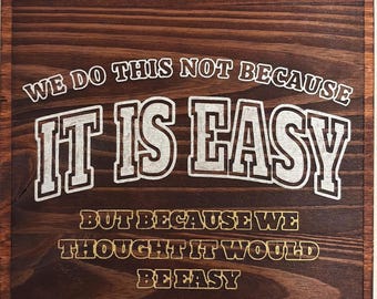 We Do This Not Because It Is Easy... Sign