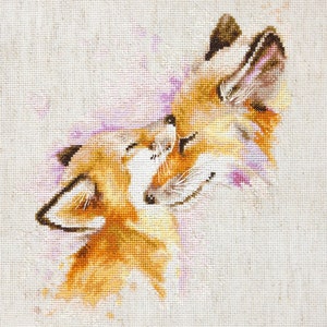 May include: Cross-stitch embroidery of two orange foxes cuddling, with a pink watercolour background.