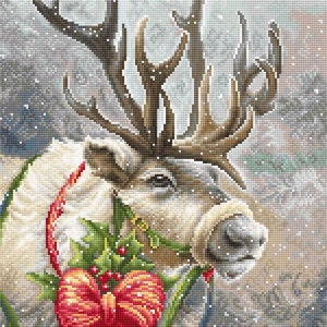 May include: A white reindeer with large antlers is decorated with a red bow and green holly. The reindeer is standing in a snowy forest setting.