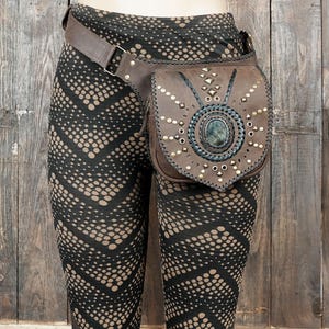 Boho gemstone waist belt bag with handcrafted detailing and brass hardware.