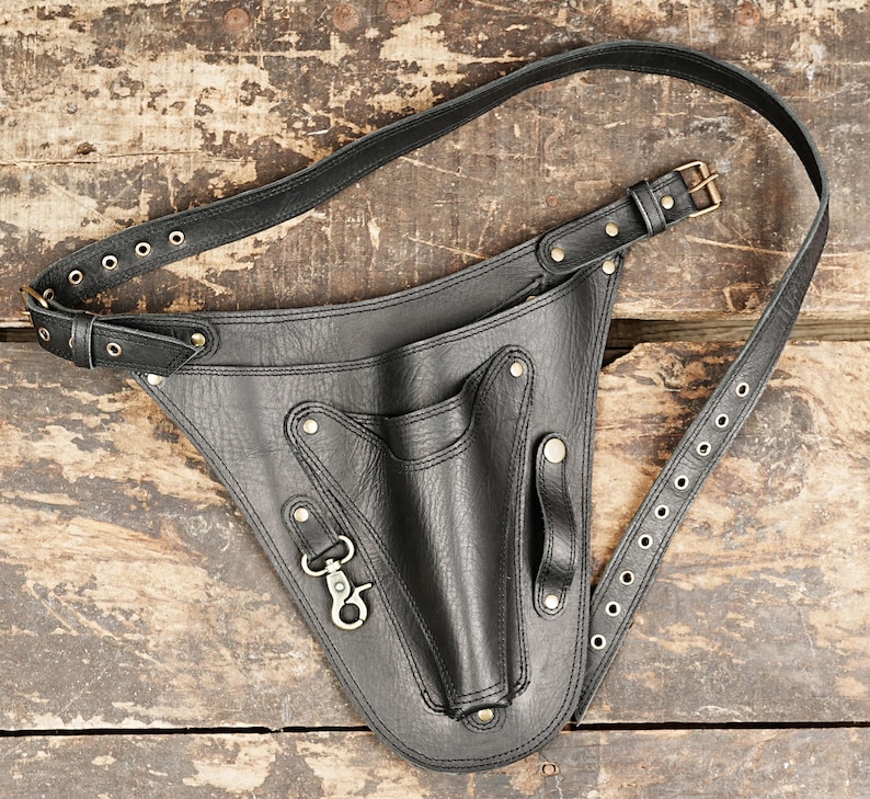 A stylish bag that holds small tools and supplies like rulers and edge bevelers.
