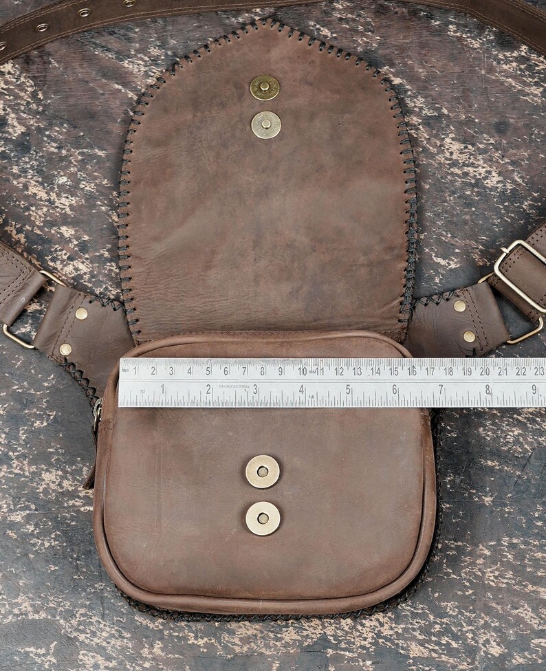 Genuine tan leather hip bag with gemstone accent and rustic handcrafted design.