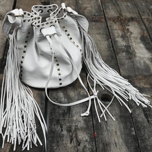 White Leather Fringe Bucket Bag with Studs and Drawstring Closure