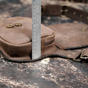 Handmade gemstone waist pouch with antique brass studs and adjustable belt.