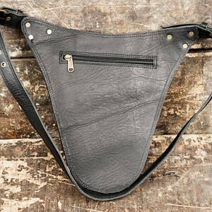 A stylish bag that holds small tools and supplies like rulers